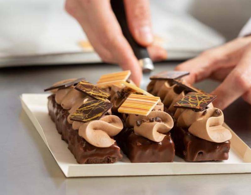 A chocolate dessert finished with Mona Lisa chocolate decor