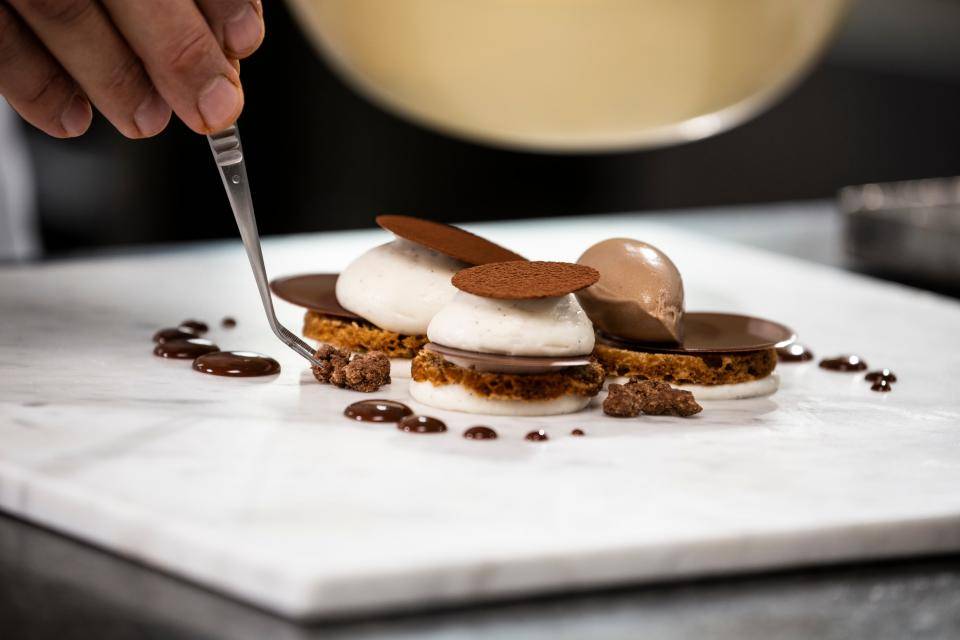 Delicious chocolates on a white marble table