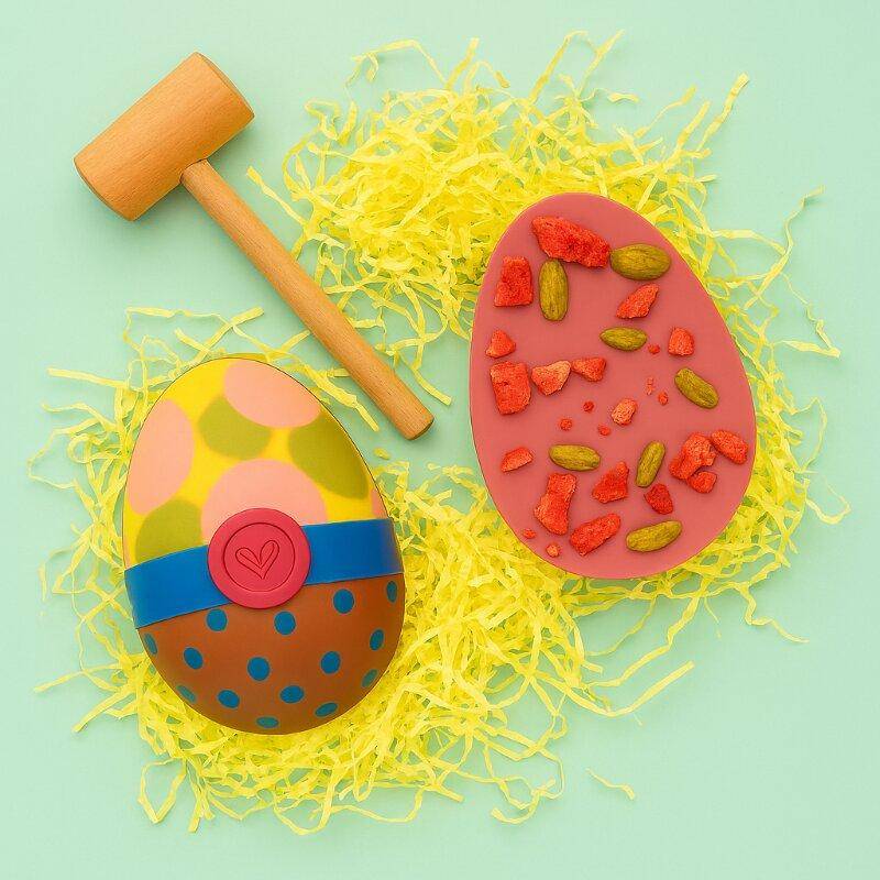 Two colorful easter eggs on a peach background