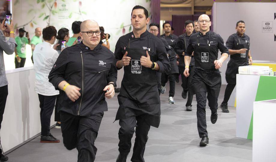 The chefs run out to get started for the day, Eero Paulamäki and Christophe Rull in front